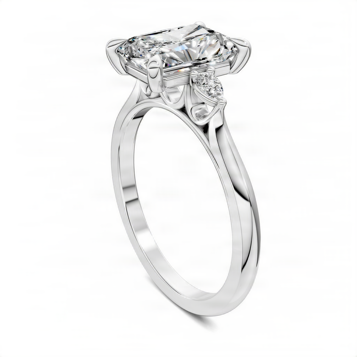 White gold three-stone engagement ring with emerald-cut center and two round side stones