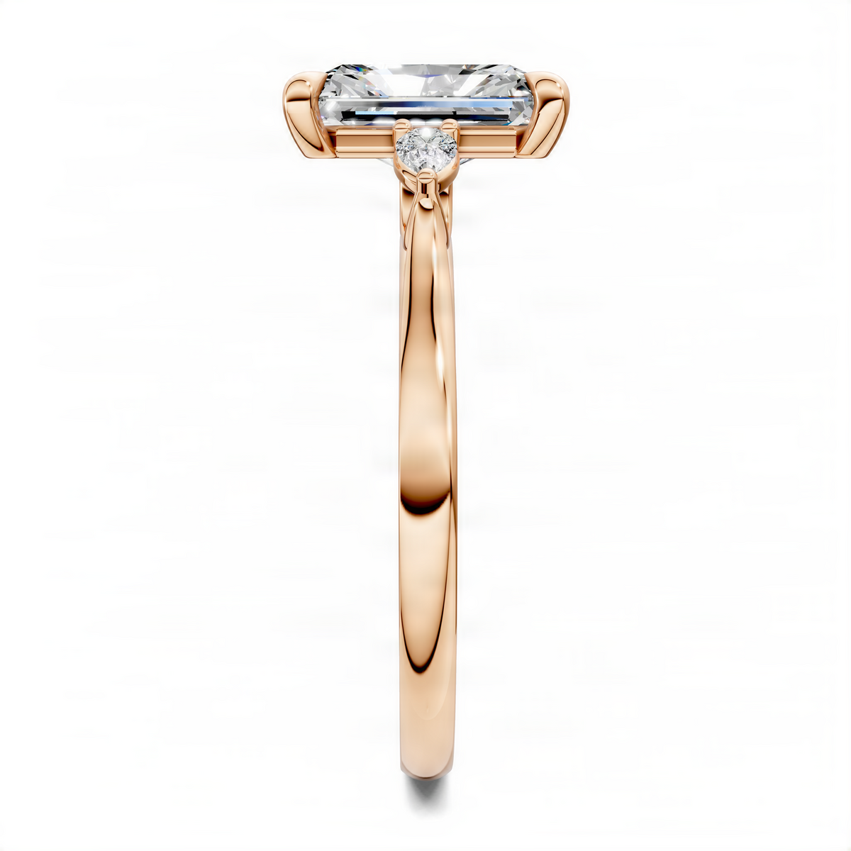 Rose gold three-stone engagement ring with emerald-cut center and two round side stones