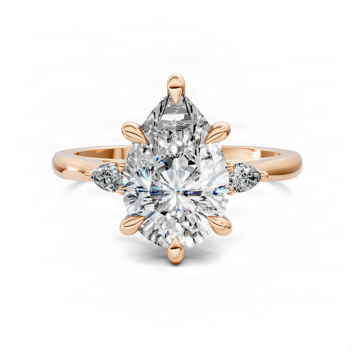 Rose gold three-stone classic ring with pear-shaped center and prong-set side stones