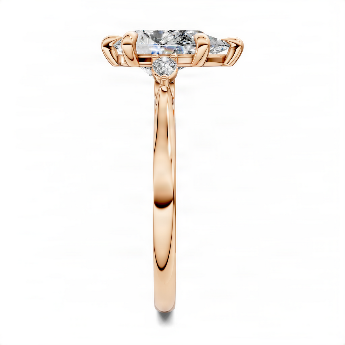 Rose gold three-stone classic ring with pear-shaped center stone and side accents