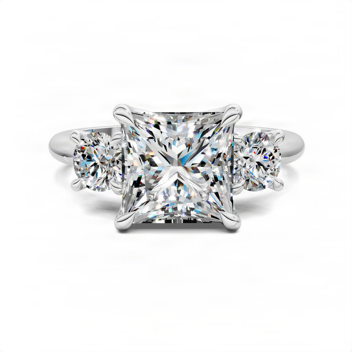 Silver-toned three-stone ring with princess-cut center stone and two round side stones