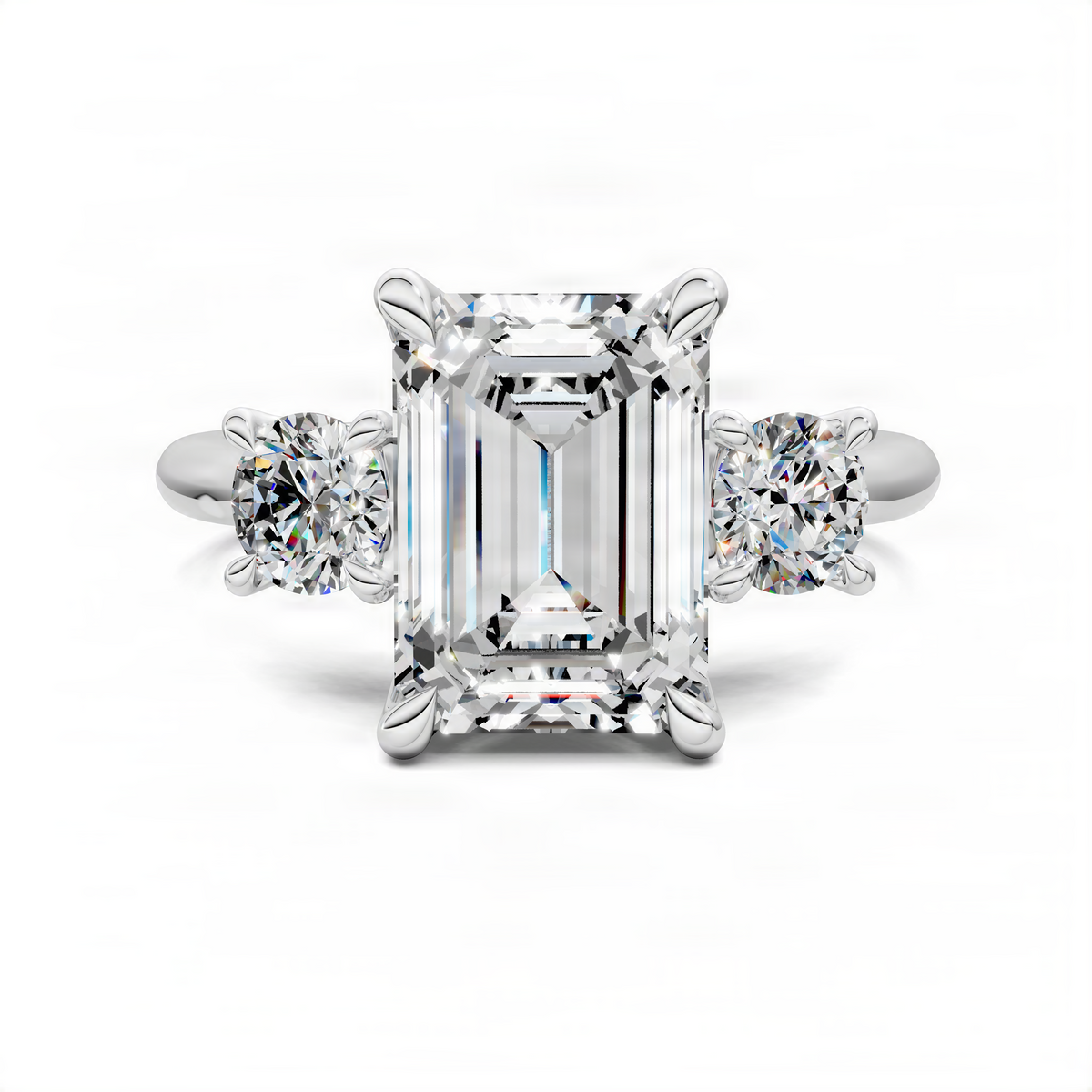 Three-stone ring with emerald-cut center stone and round side stones, white gold