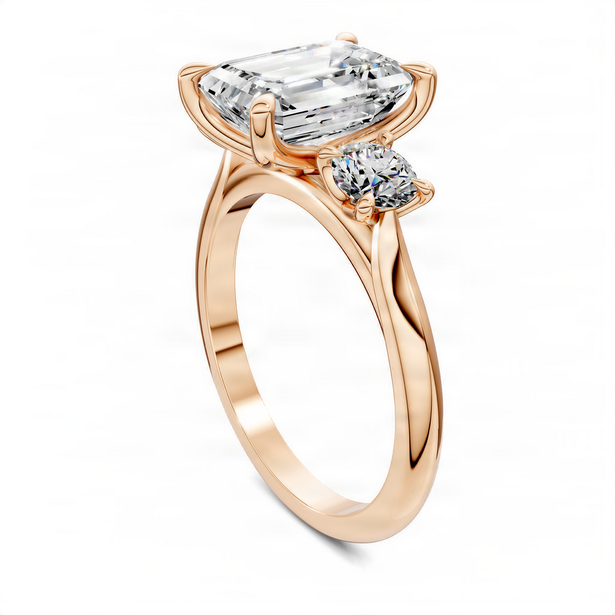 Rose gold three-stone ring with emerald-cut center and round side stones