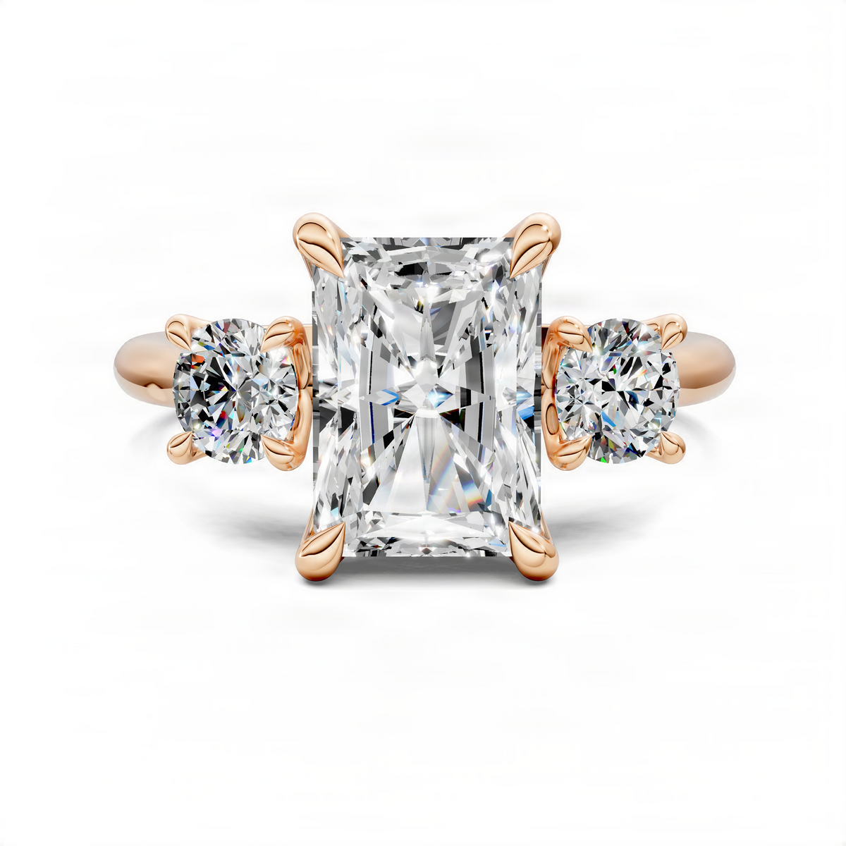 Rose gold three-stone ring with large square center diamond and two round side diamonds