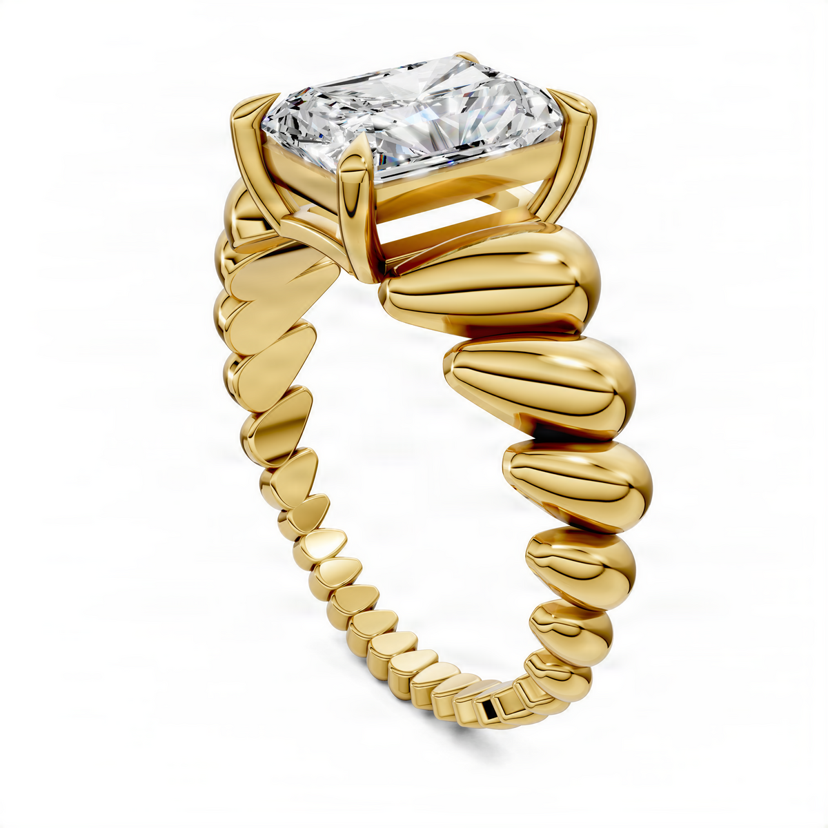 Yellow gold radiant croissant ring angled view with square-cut clear center stone
