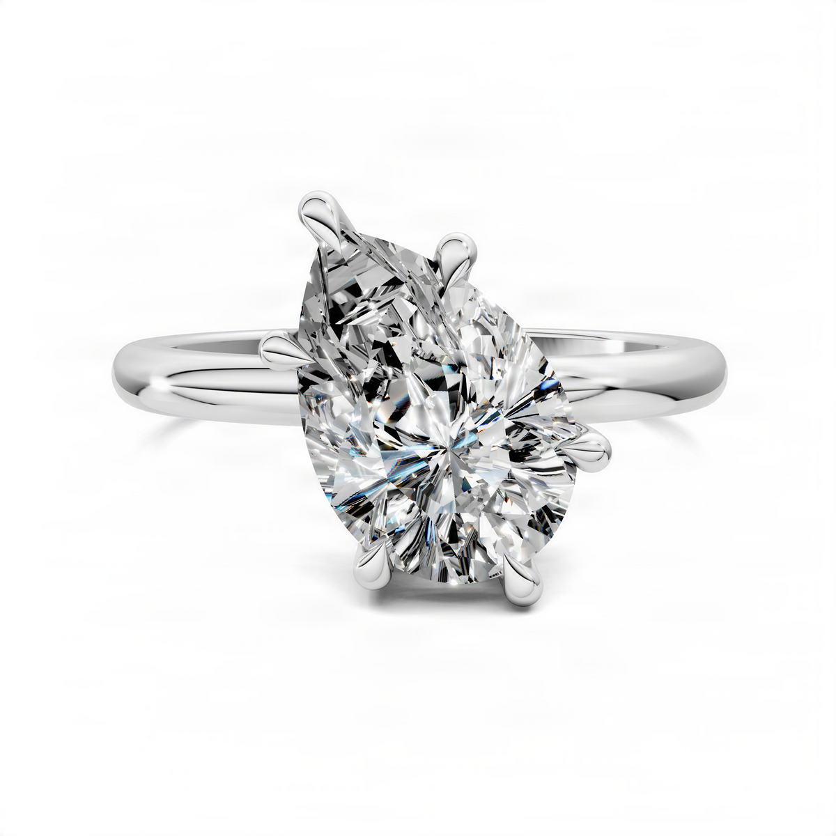 Pear-shaped solitaire ring with angled prong setting on a silver-toned band