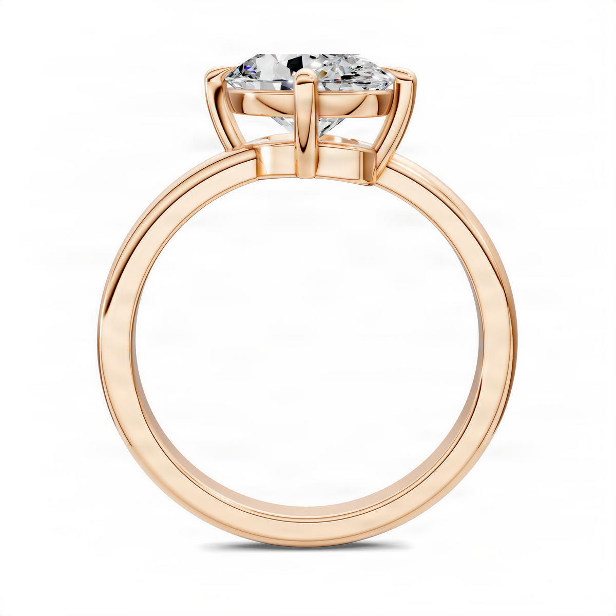 Oval solitaire ring with rose gold metal, side profile showing open basket and prongs