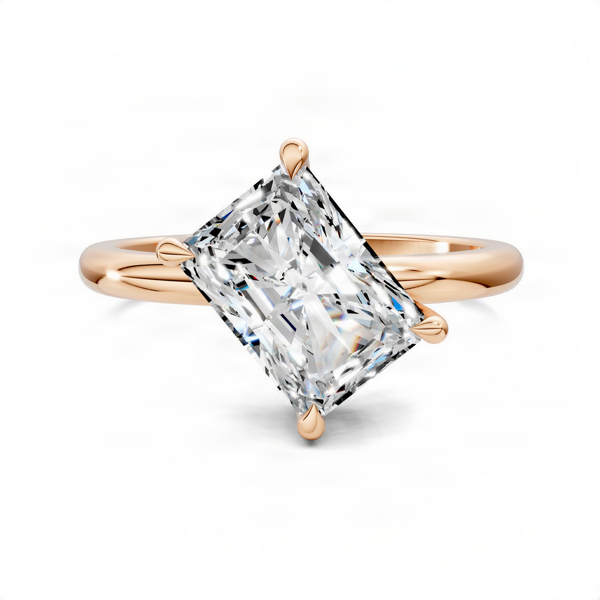 Rose gold angled solitaire ring with emerald-cut diamond-style center stone and split band
