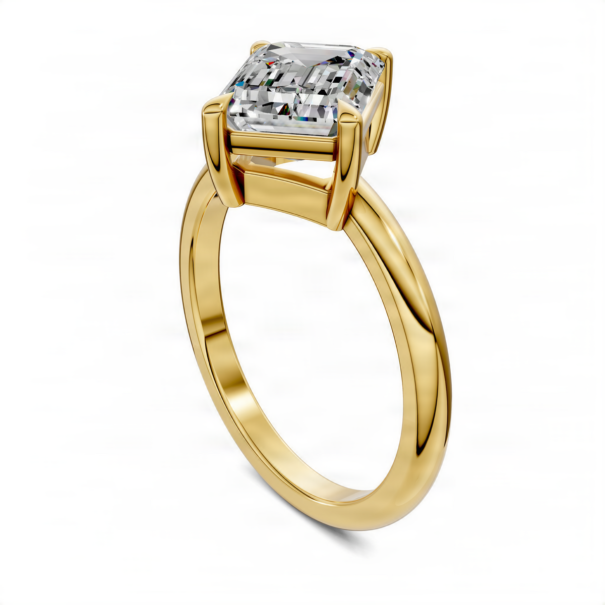 Yellow gold solitaire ring with emerald-cut center stone, top angled view