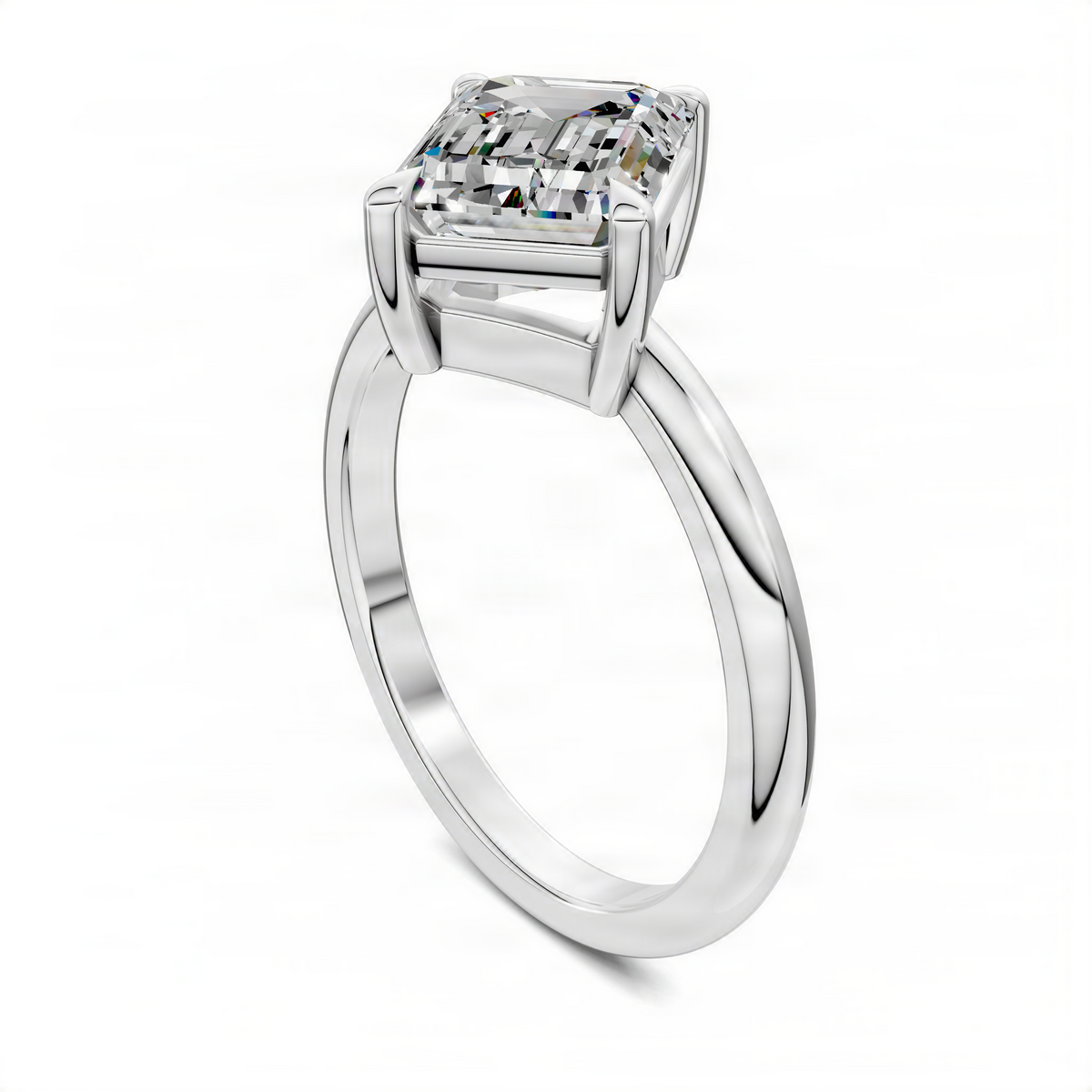 Platinum solitaire ring with emerald-cut center stone, side view