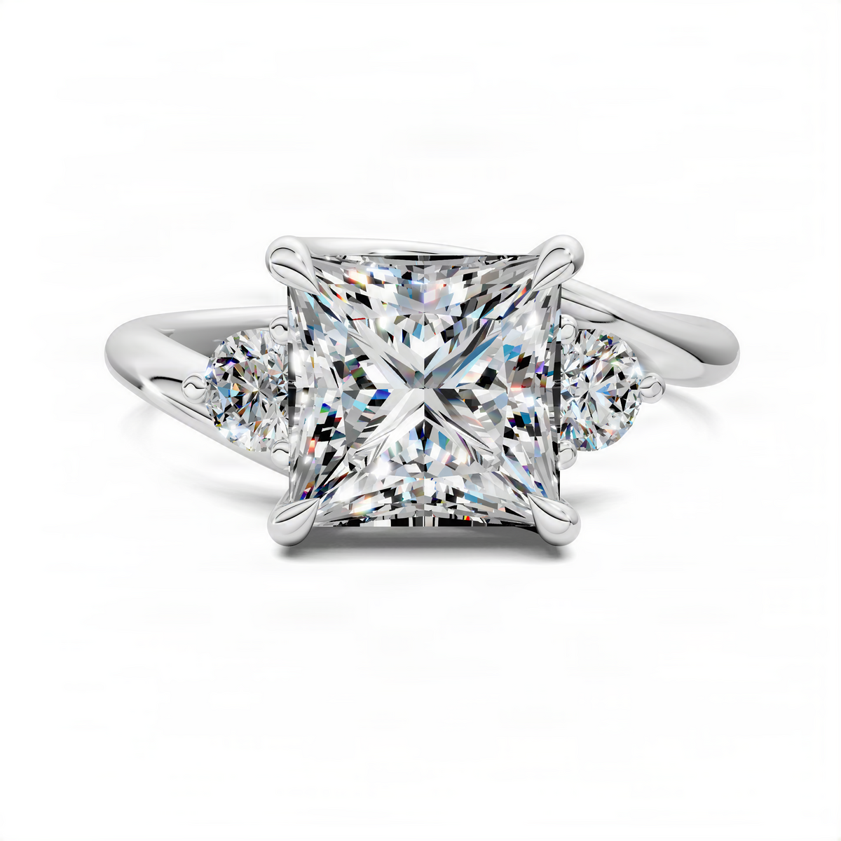 Bypass three-stone ring in white metal with rectangular center and round side stones