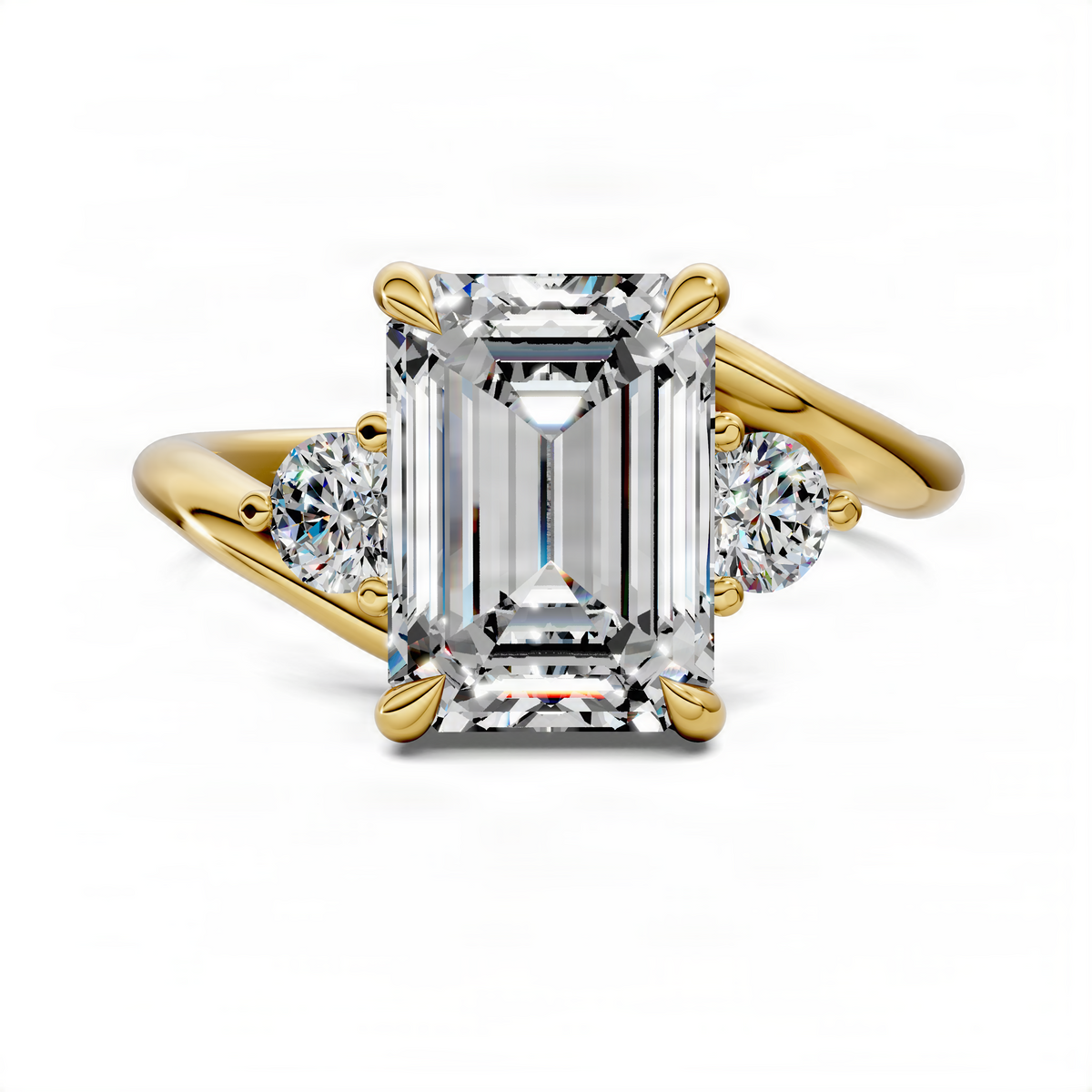 Three-stone bypass ring in yellow gold with emerald-cut center and round side stones, front view