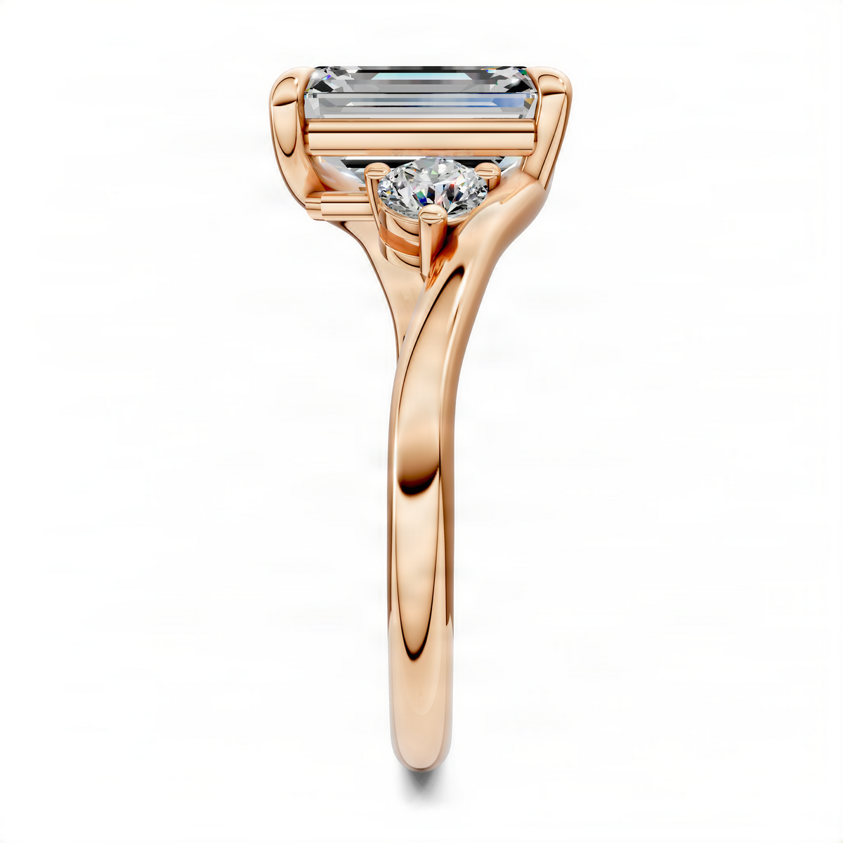 Rose gold bypass three-stone ring with emerald-cut center stone and prong-set side stones