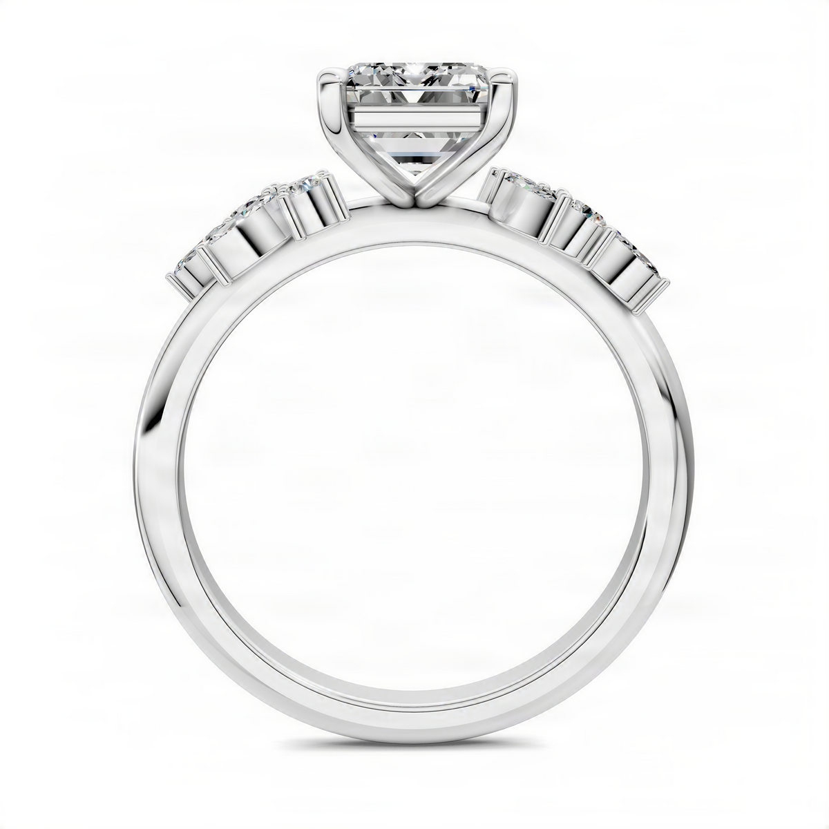 Silver-toned ring band with baguette accents and emerald-cut center setting, top view
