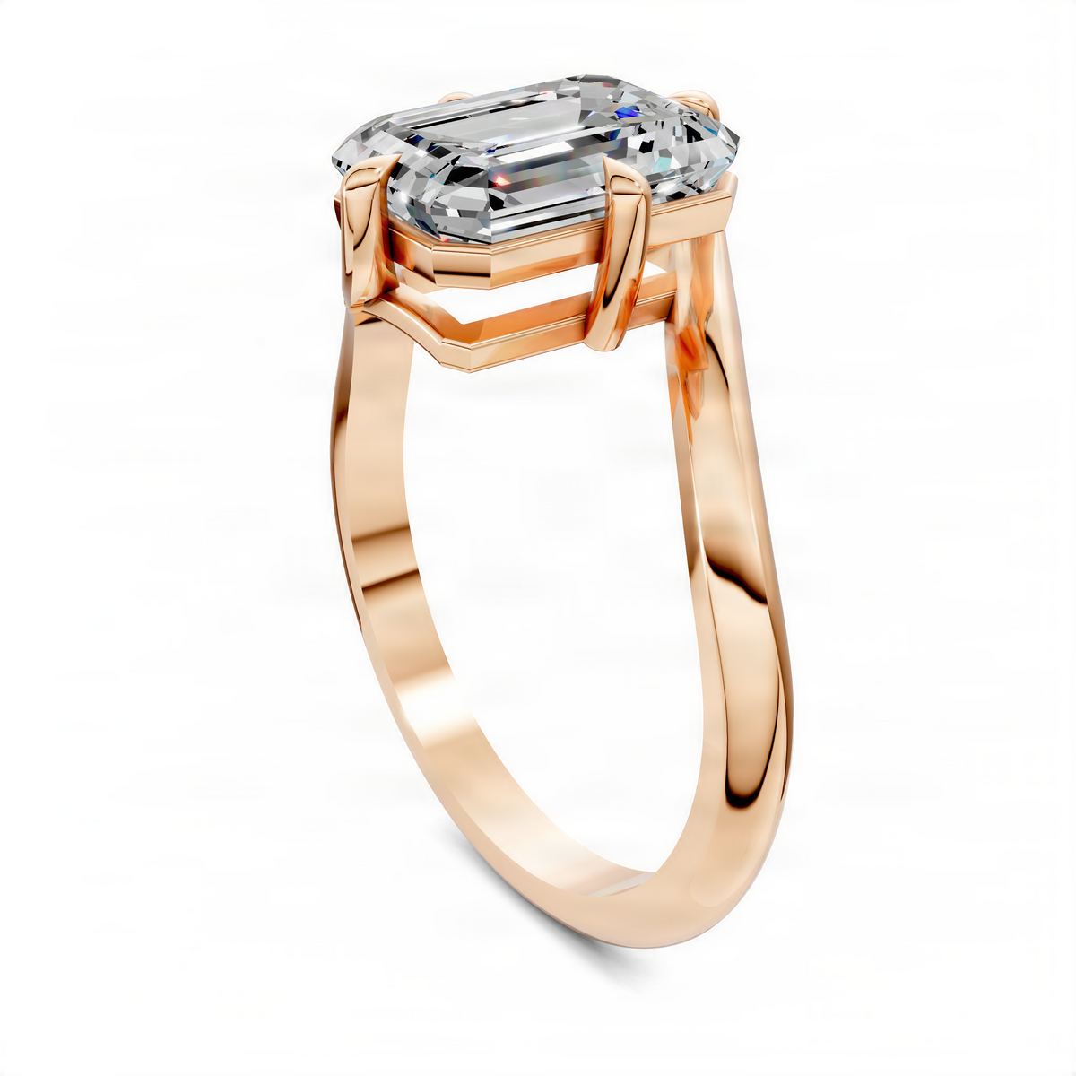 Rose gold bypass solitaire ring with emerald-cut diamond center stone and curved band