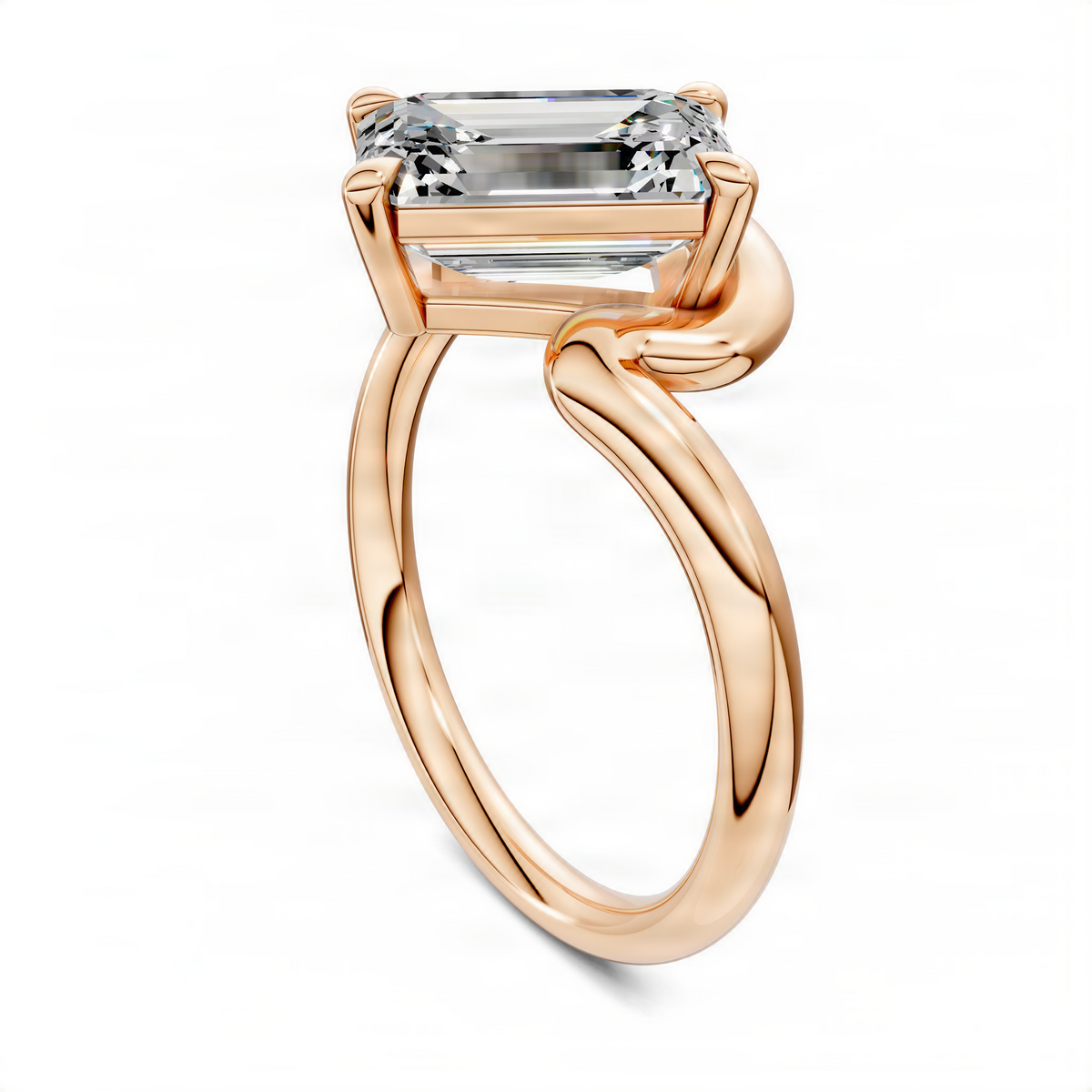 Rose gold emerald-cut solitaire ring showing curved band and four-prong setting