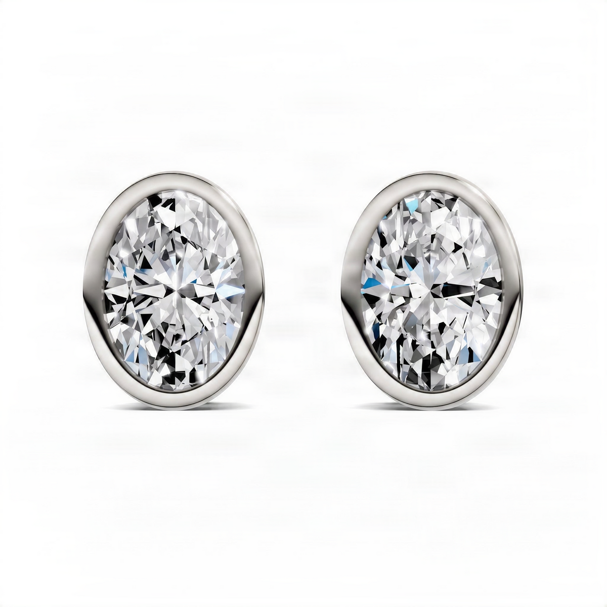 Oval bezel stud earrings with clear oval crystal, white gold bezels and posts